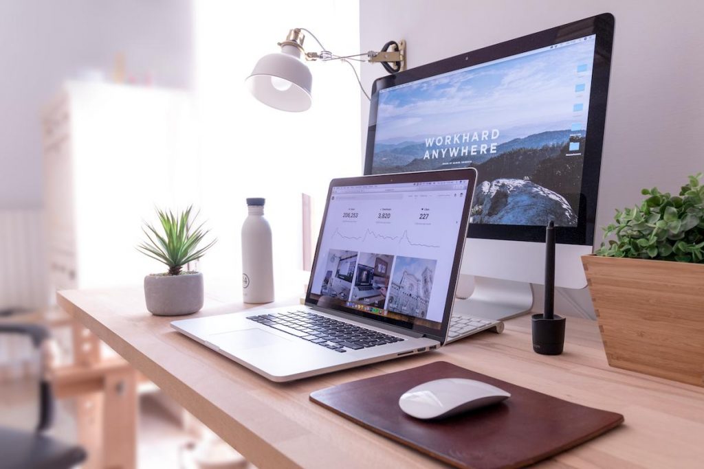 laptop and desktop on the desk