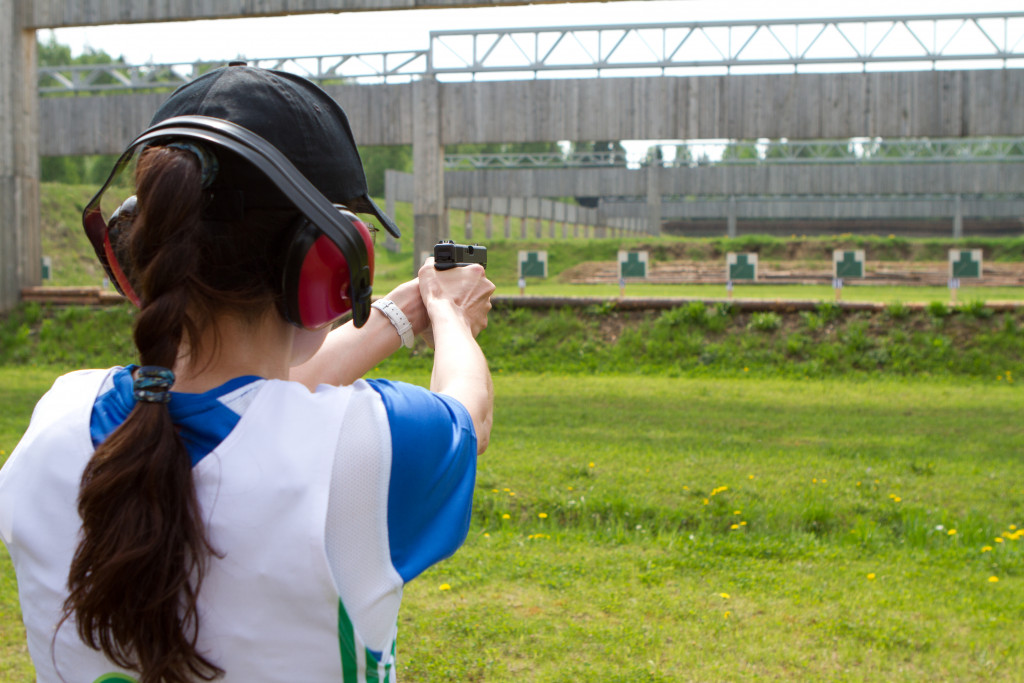 woman shooting in a range