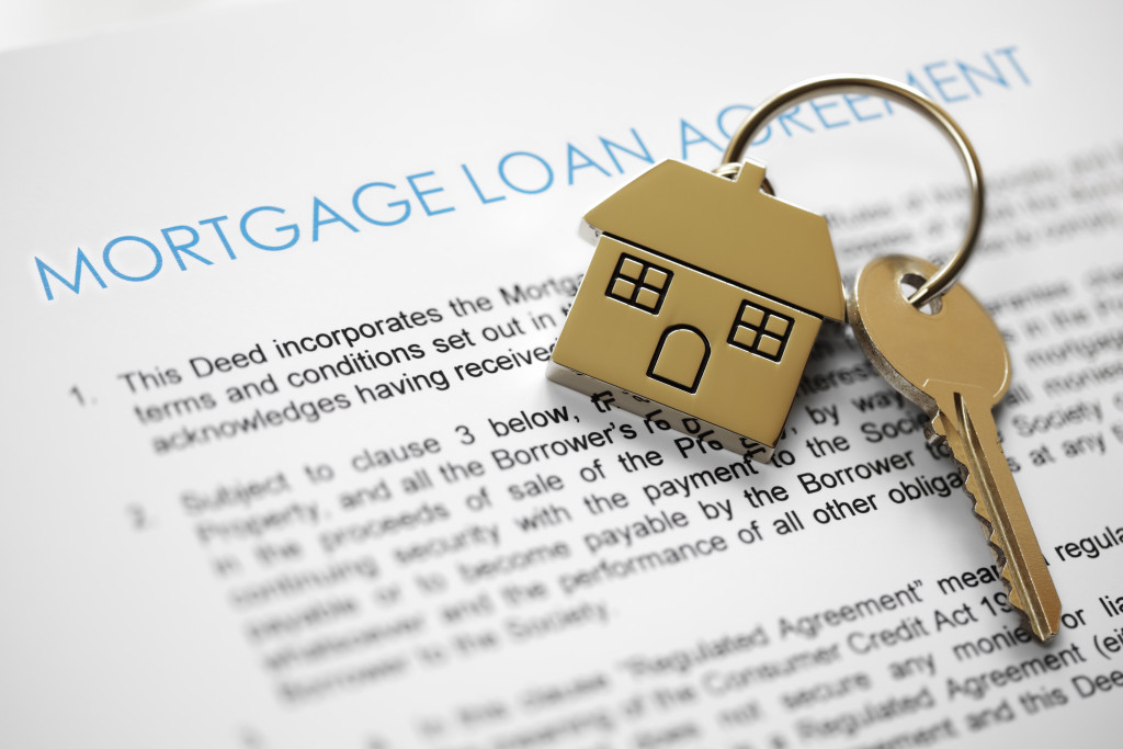 A mortgage loan agreement with a house-shaped keyring