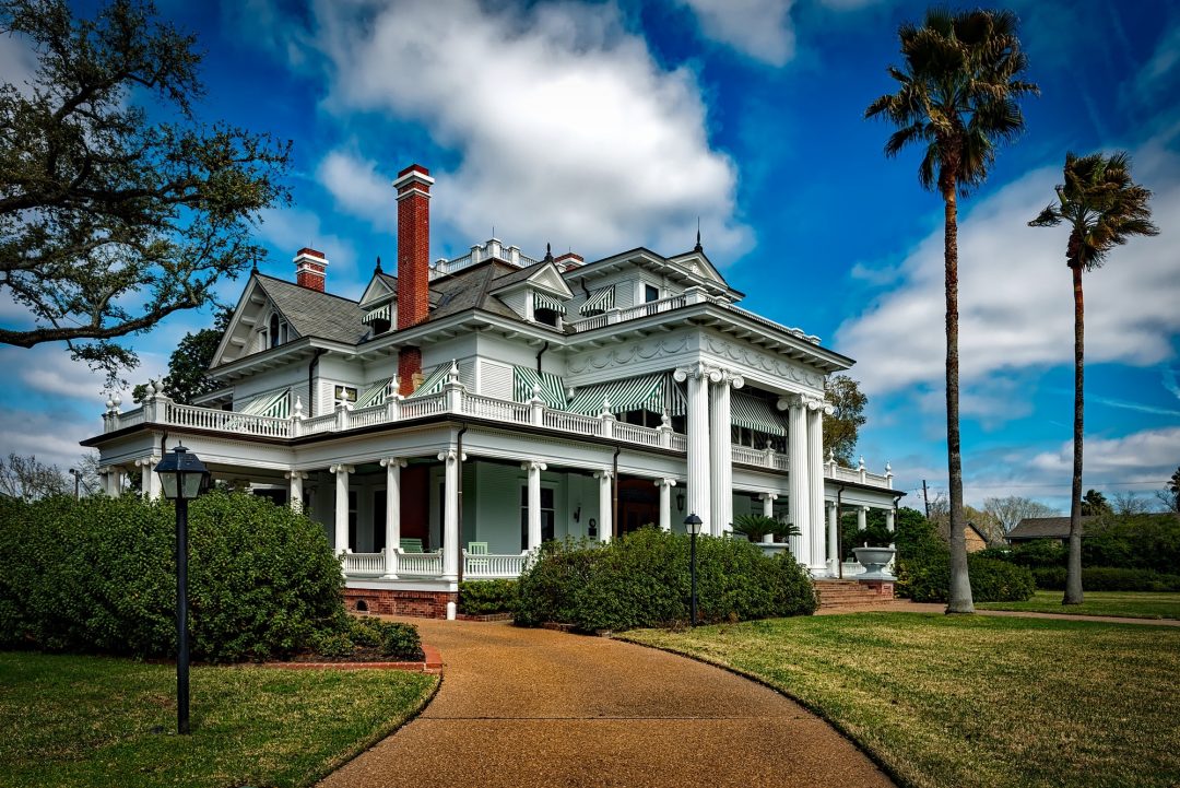 mansion with landscaping