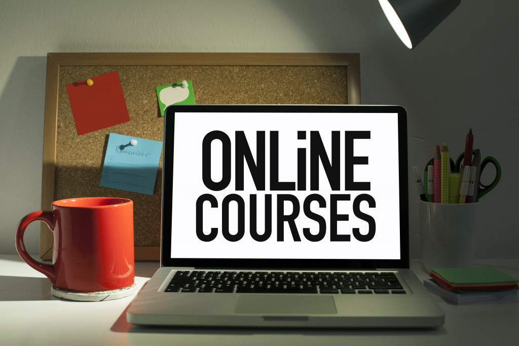 online courses displayed on laptop with orange mug