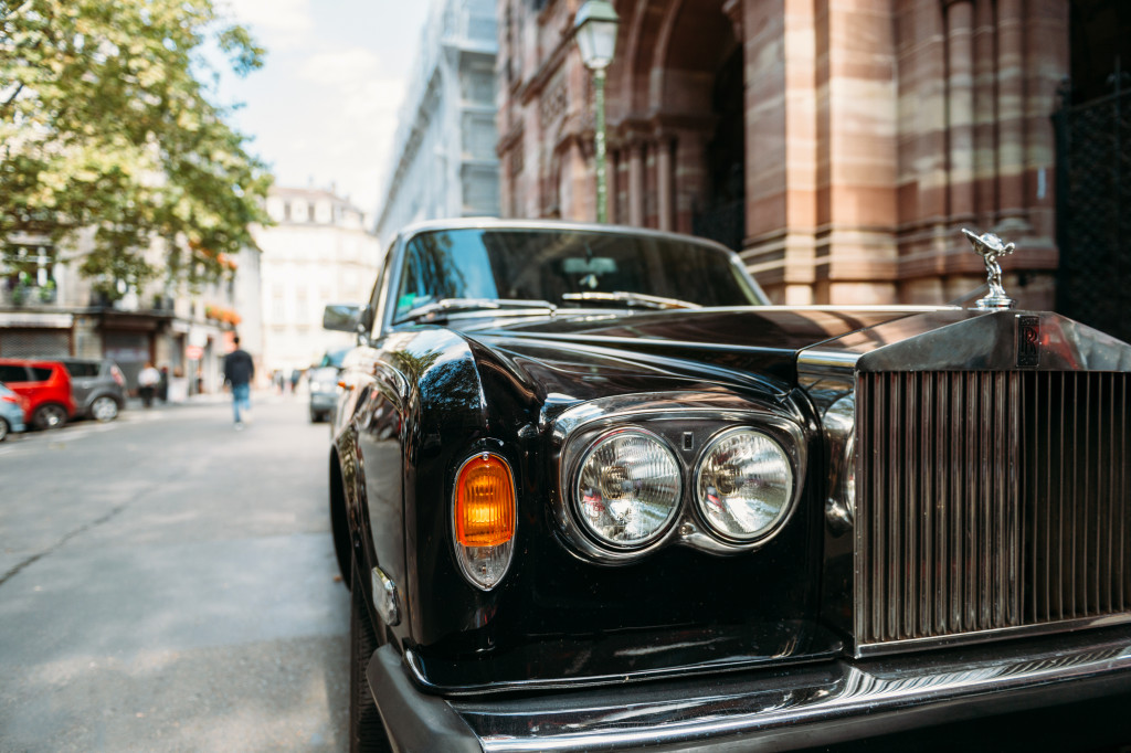 A fancy company car parked on the sideway