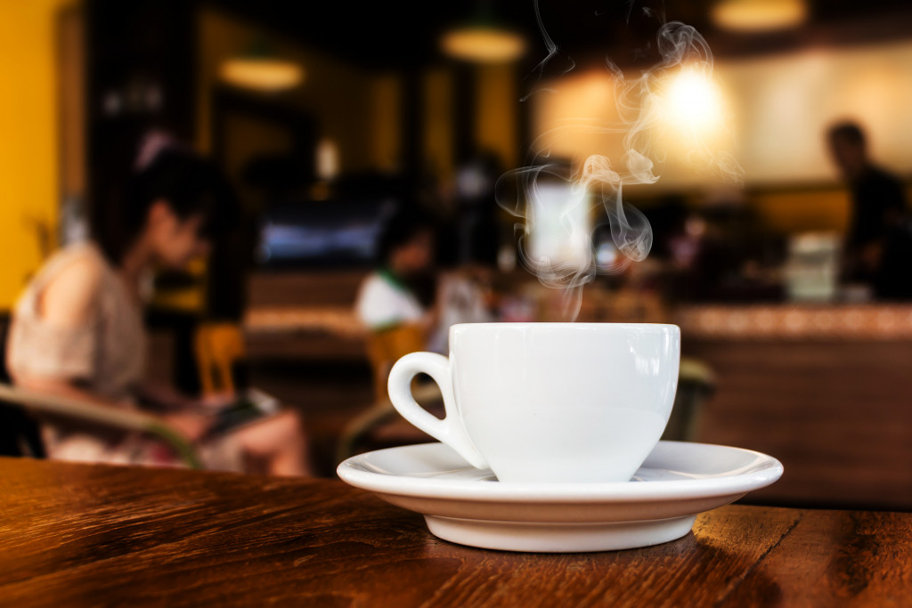 Cup of coffee on table in cafe