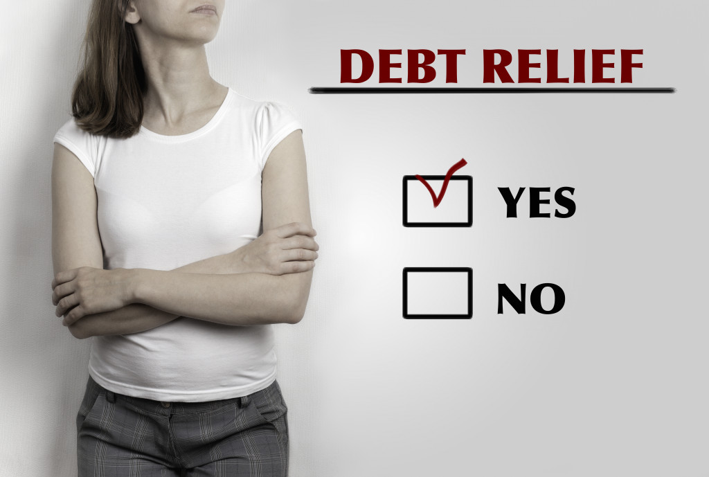 woman beside debt relief with yes checkbox marked