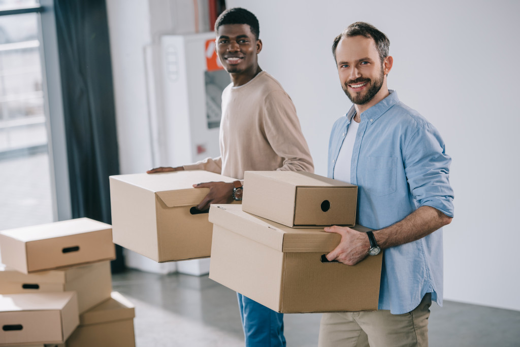 Home based business; men holding boxes