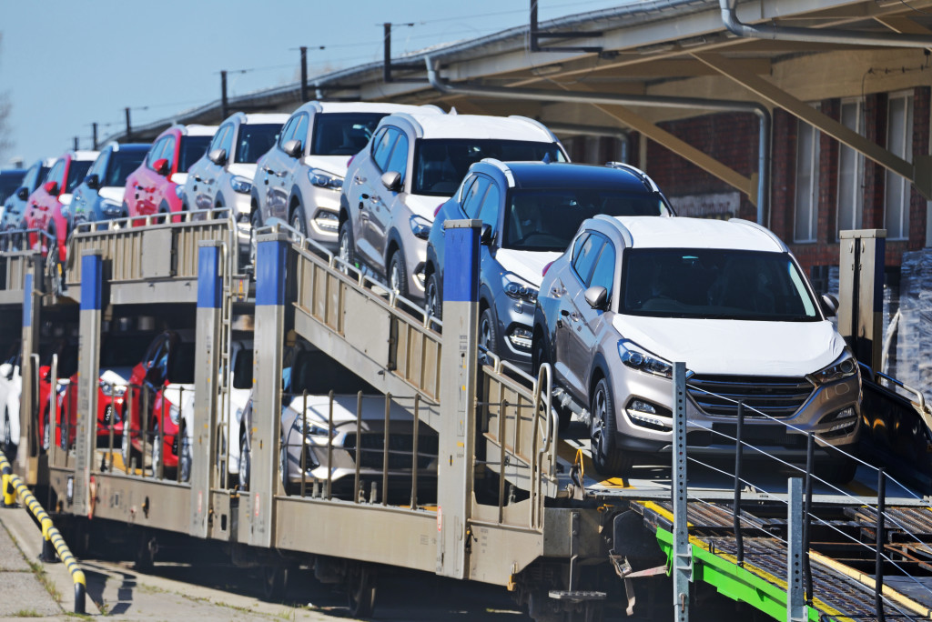 vehicles on an open ramp about to be transported