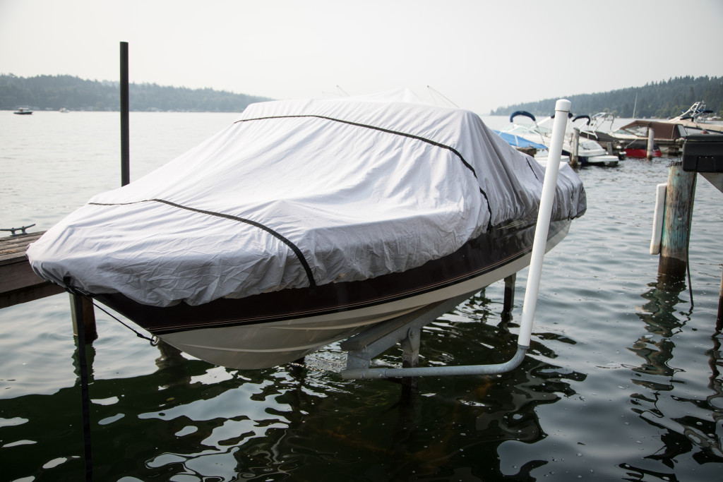 A covered boat docked in a port