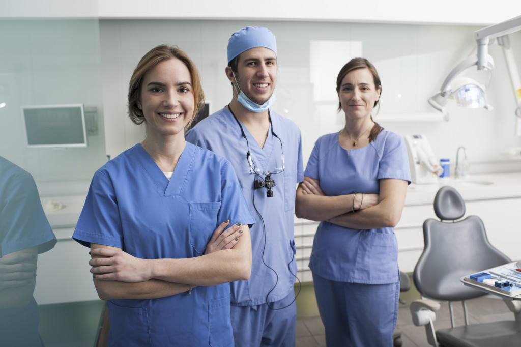 Cheerful group of dentists and their assistants