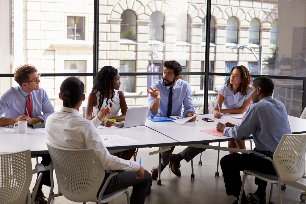 Executives discussing the growth of a business in the boardroom of the office.