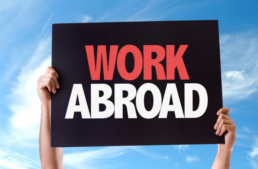 work abroad signage against sky background