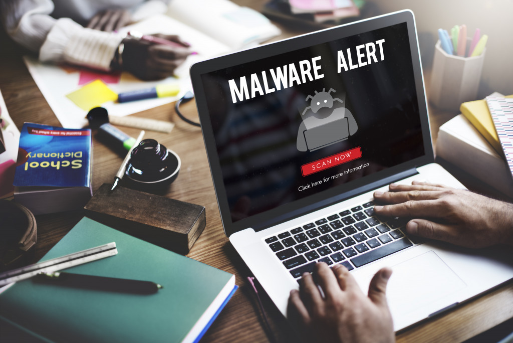 malware alert on laptop antivirus software concept