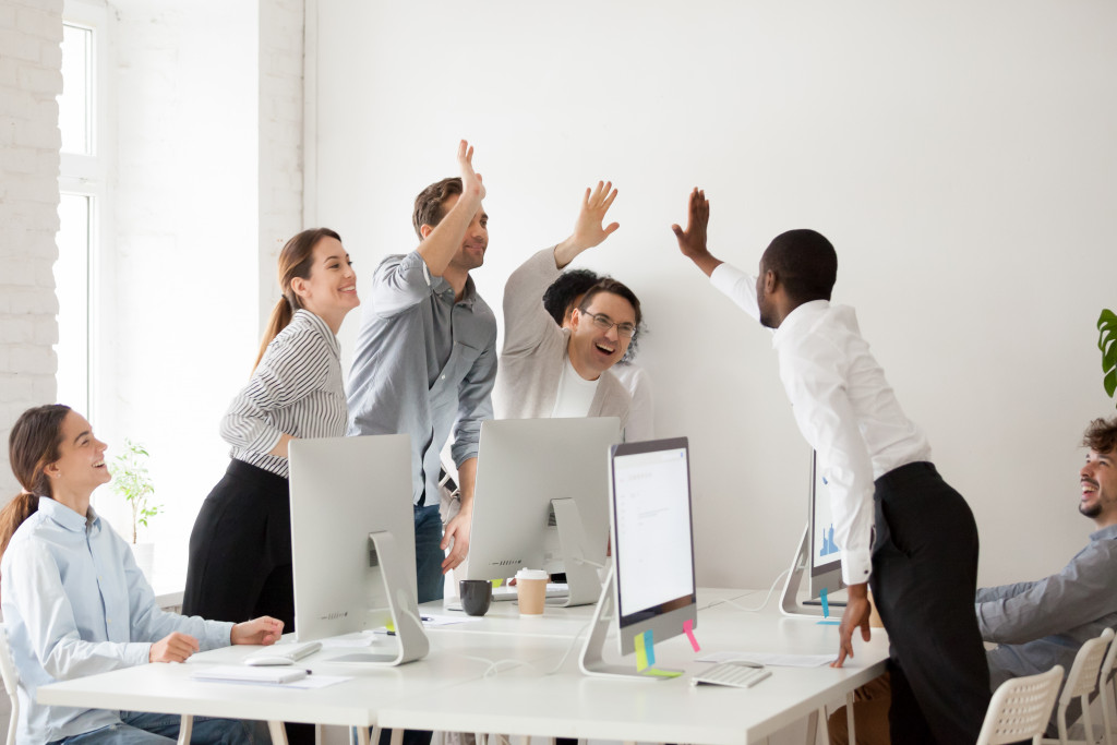 a team happy anddoing a high five