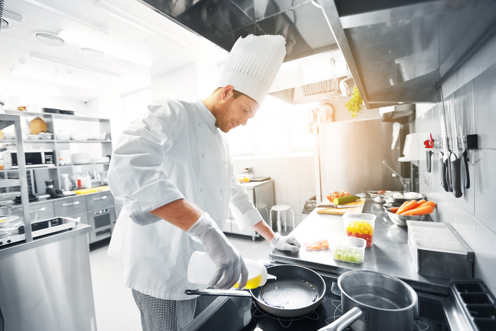 chef cooking with natural light at the back