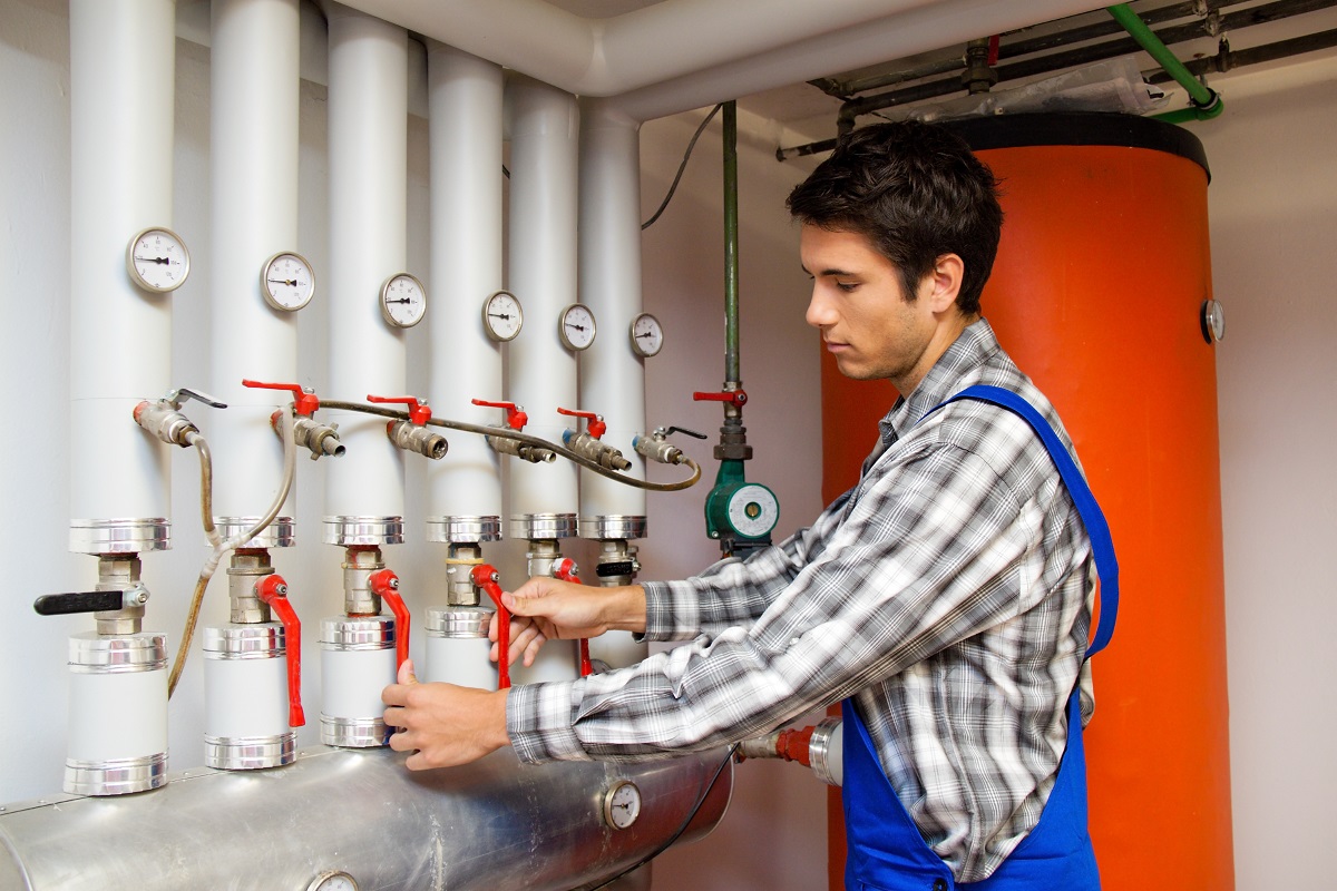 an engineer checking heating system