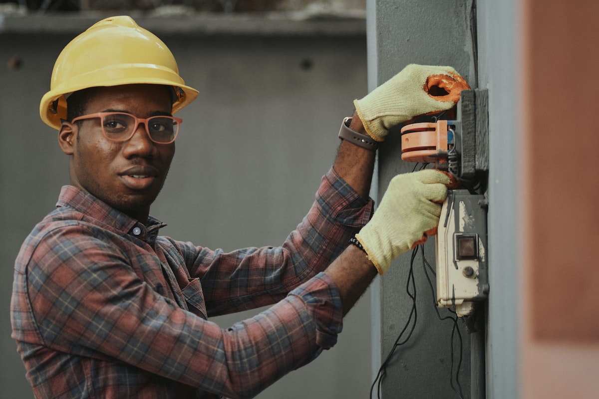 an electrician working on a building floors electrical flow