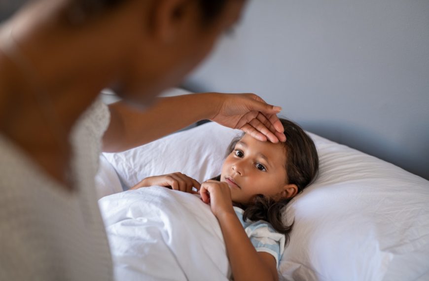 sick kids being checked by dad