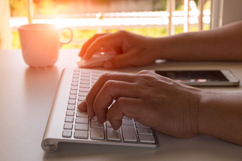 A person typing on a keyboard