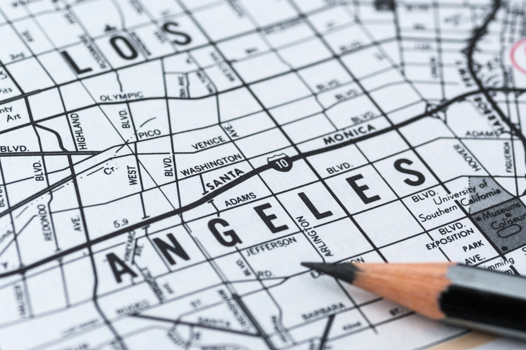 Person checking a potential location for a shop on a map.