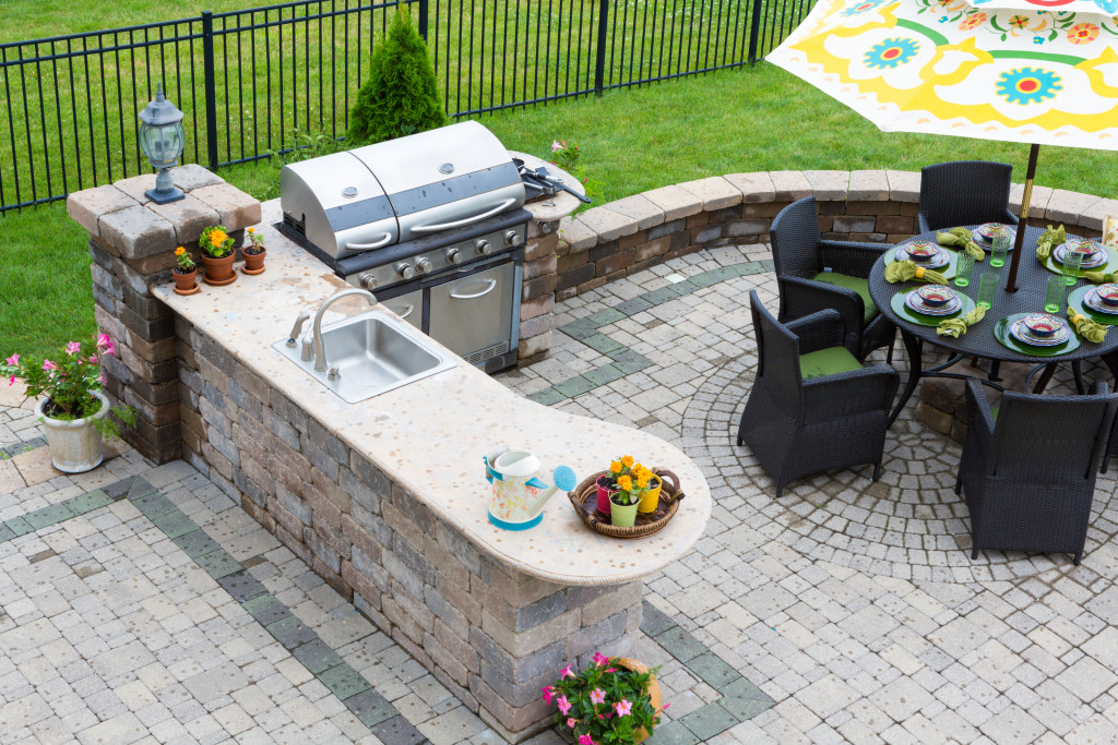 outdoor kitchen with small dining area in the side