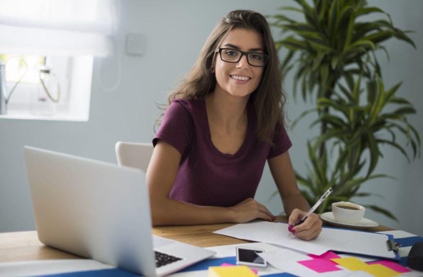 young woman working and smiling