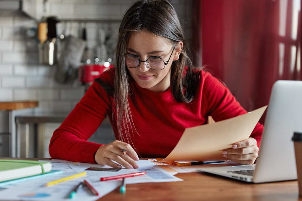 young woman sitting managing finances