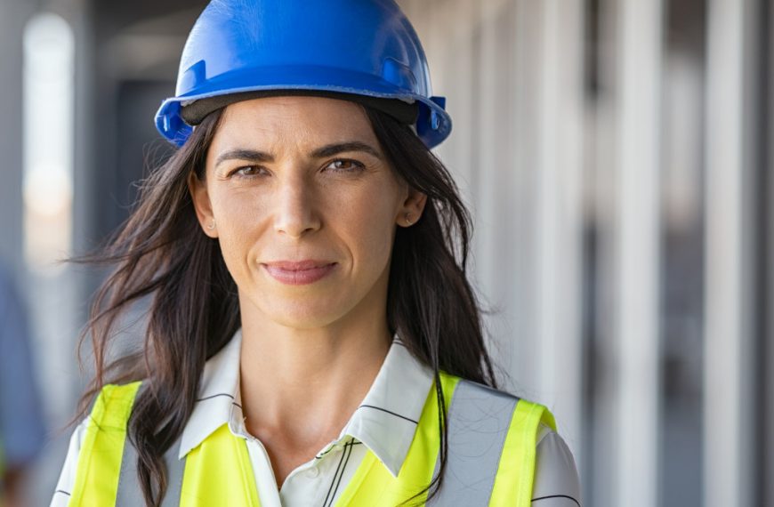 woman wearing blue hard hat