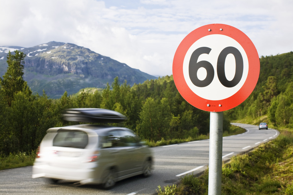 A speed limit sign on the side of the road