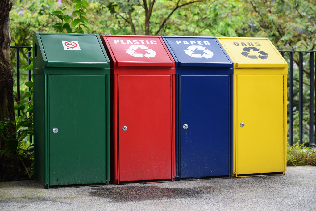 A row of various trash cans